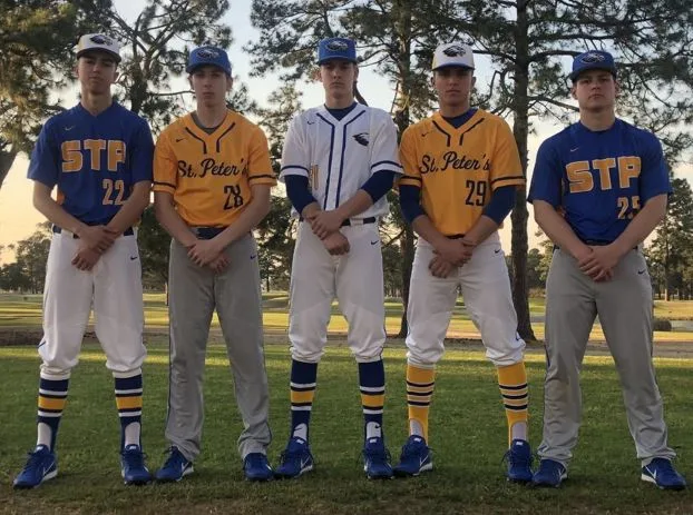 High school baseball players in team uniforms