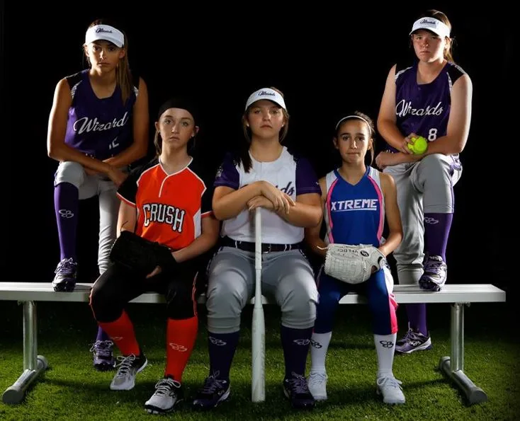 Players in custom youth softball uniforms