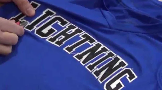 Tackle twill numbers on a baseball uniform