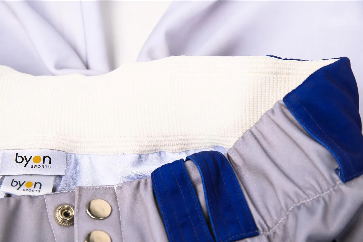 Button detail on custom baseball pants