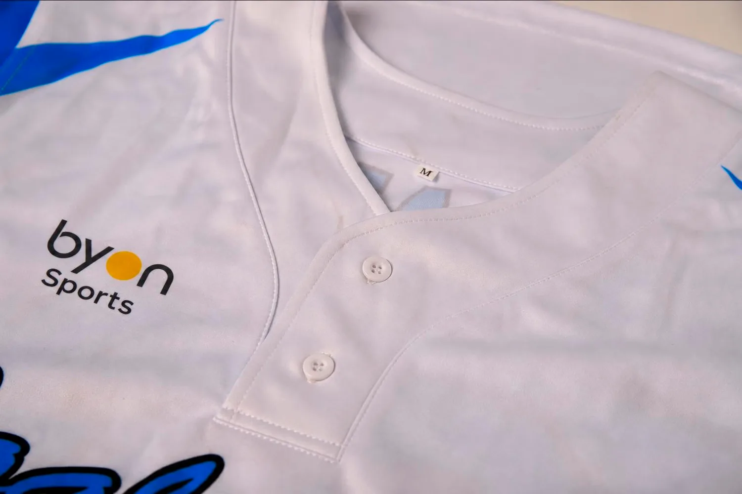 Neck detail on a custom sleeveless baseball jersey