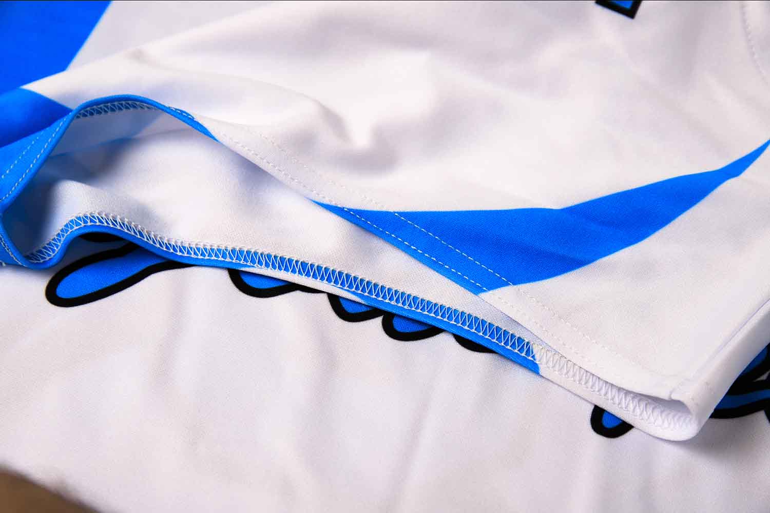 Stitching detail on a custom sleeveless baseball jersey